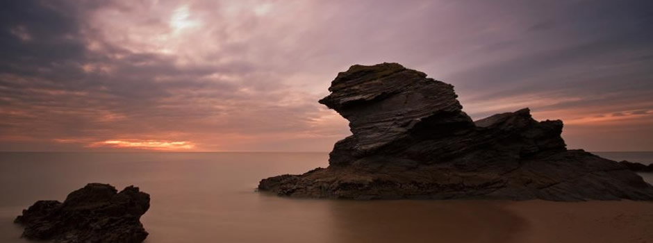 Llangrannog beach between wooded cliffs